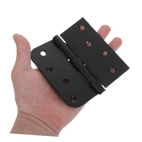Premium Black Matte Indoor Door Hinges For Interior Wood Doors Stainless Steel set shown in hand for scale, detailed view of hinge.