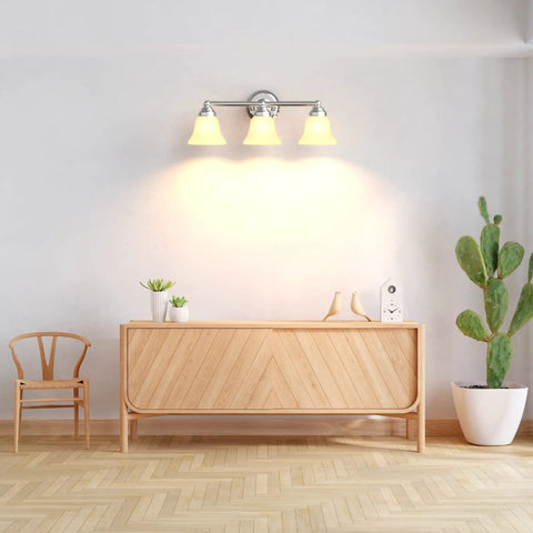 Dope Three Light Chrome Vanity Light Fixture With Frosted Glass Shades mounted on wall above wooden console in modern room.