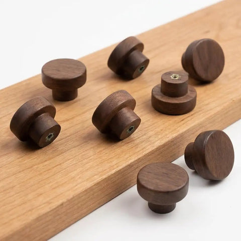 Top Shelf Mid Century Modern Walnut Mushroom Cabinet Knobs Slick Round Drawer Pulls on wood background, set of eight.