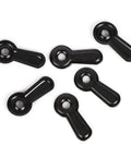 Six black plastic turn-button fasteners for photo frames in a top-down view