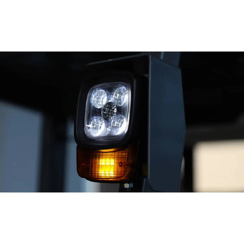 Heavy Duty Electric Forklift With LED Light And Safe Driving Axle, showing illuminated LED lights on the mast for enhanced visibility.