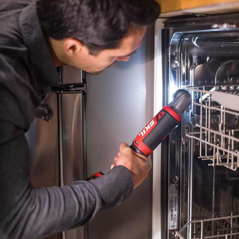 Person using Two Tool Cordless Drill And Right Angle Impact Kit with 12V Brushless Power on kitchen appliance