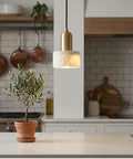 HLRCB Indoor Pendant Light, Marble Adjustable Drop, Modern Suspended Mount in a stylish kitchen setting.