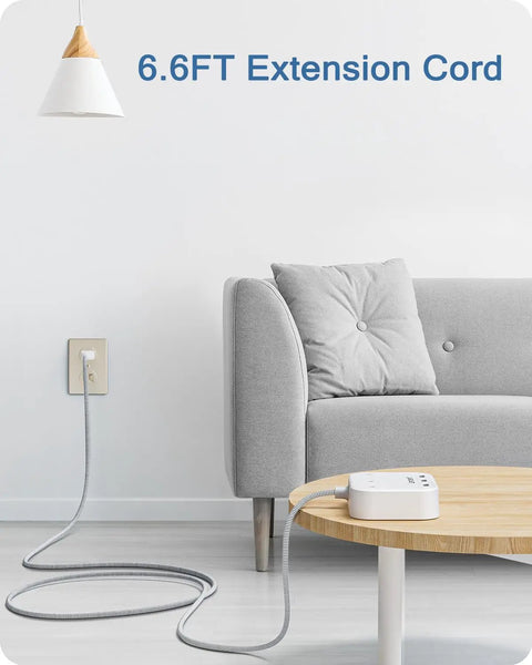 Room setup with 2 Prong To 3 Prong Outlet Adapter With A 6.6 Ft Braided Extension Cord connected to sofa and table.
