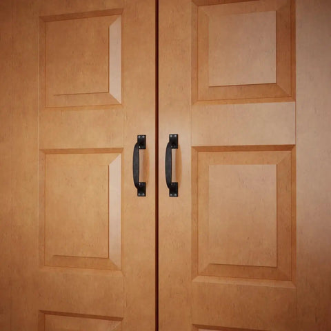 Dang Sturdy Six Inch Black Wrought Iron Cup Bin Pull Cabinet Handles on wooden cabinet doors.