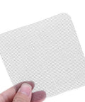 Close-up of a mesh patch from a 10 Piece Screen Repair Patch Kit For Windows, Doors And Tents Easy Adhesive Patches To Fix Tears, Holes, And Rips Without Expensive Replacements Ideal Emergency Camping Gear And DIY Home Screen Repair.