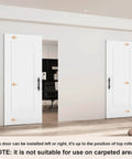 Concealed Barn Door Kit 36x84 with soft close hardware and matte black pulls, shown installed in white room, solid core, flat panel.