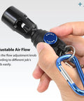 Hand holding Compact Plastic Air Blow Gun with high flow nozzle and adjustable flow knob for electronics and workshop use.