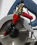Close-up of Plug And Go Dust Control Water Sprayer attachment on angle grinder for wet cutting, showcasing slick mist cooling tip.