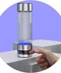 Portable Hydrogen Water Bottle Generator For Everyday Hydration Hack With Purifying Tech, Glass BPA Free Bottle on pedestal