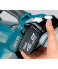 No Nonsense 36V Brushless Cordless Leaf Blower With Beast Mode Airflow, showing 18V battery being inserted.