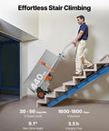 Man using VEVOR Electric Stair Climbing Dolly 440 Lb Capacity Heavy Duty Hand Truck on stairs, showcasing its effort-free design.