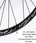 Close-up of All Terrain Mountain Bike Wheelset for 29, 27, and 26 inch rims, showing black spokes and 15mm copper nipples