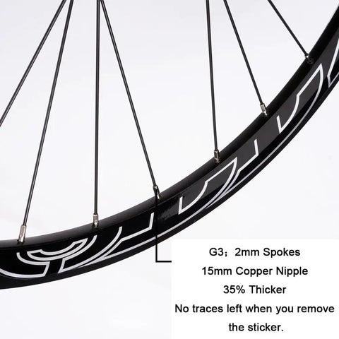 Close-up of All Terrain Mountain Bike Wheelset for 29, 27, and 26 inch rims, showing black spokes and 15mm copper nipples