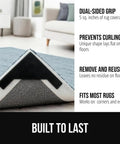 Extra Wide Dual Sided Rug Gripper Pads for Hardwood Floors showing gripper under a rug corner, preventing curling, in a living room.