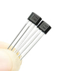 Top Tier Hall Effect Sensor Magnetic Detector Pack Of Twenty For Arduino Projects Offering Four Point Five To Twenty Four Volt Operation And Reverse Polarity Shield Delivers A Kickass Setup For Street Rod Wiring And Smooth Electronic Switching Control with hall effect sensors shown in hand.