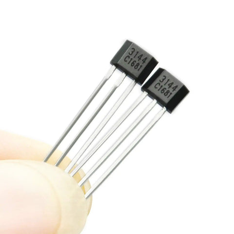 Top Tier Hall Effect Sensor Magnetic Detector Pack Of Twenty For Arduino Projects Offering Four Point Five To Twenty Four Volt Operation And Reverse Polarity Shield Delivers A Kickass Setup For Street Rod Wiring And Smooth Electronic Switching Control with hall effect sensors shown in hand.