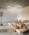 Lit LED Ring Pendant Light With Remote Control 23.6 Inch Halo Chandelier installed in modern minimalist bedroom.