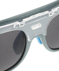 Close-up of Built Different Welding Safety Goggles With Top Shelf Impact Resistance And Dust Splash Proof Black Gray Lenses.