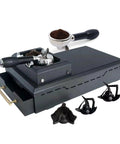 Electric Espresso Knock Box And Automatic Portafilter Cleaner For Dead Simple Puck Removal with accessories and portafilter.