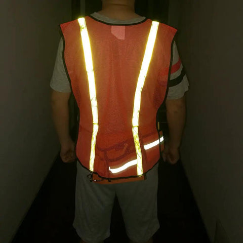 Back view of a person wearing High Visibility Reflective Safety Vests 10 Pack, Adjustable Lightweight Neon Orange with reflective strips.