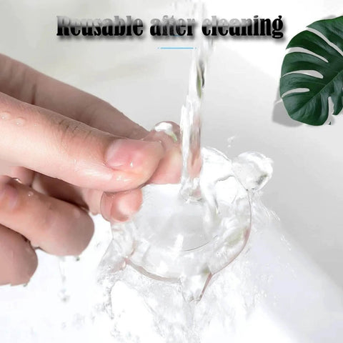 Hand washing a clear rubber bumper shield; demonstrates how the product is reusable after cleaning.