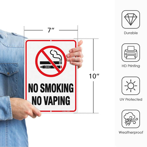 Person holding No Smoking No Vaping Signs 10x7 Inches Reflective Aluminum Weatherproof Indoor Outdoor Use 6 Pre Drilled Holes For Easy Mounting 4 Pack