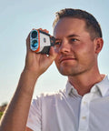 Man using V6 Shift Laser Rangefinder With Slope Compensation And PinSeeker, 6X Magnification, 1300 Yard Range, Magnetic Mount.
