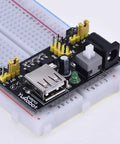 Six Pack Breadboard Power Supply Modules USB DC Regulated Low Voltage Board With Five Volt And Three Point Three Volt Outputs For Breadboards Ideal For School Lab And Hobby Projects on a breadboard