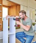 Man using Rock Solid 18V Cordless Drill Driver With Kickass 45 Nm Torque to assemble furniture in a modern home.