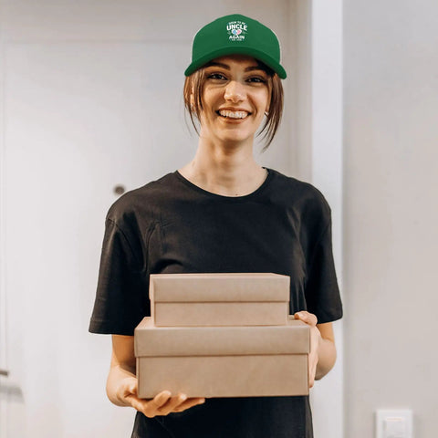 Woman wearing Green Mesh Snapback Hat For Men Adjustable Trucker Cap With Dad Vibes holding cardboard boxes indoors