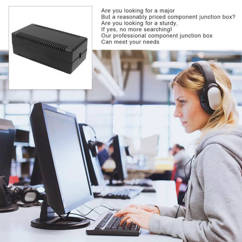 Slick Black Plastic Junction Box Cases For Circuit Boards With Secure Snap Lid Design on a desk, ideal for DIY projects.