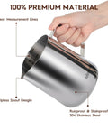 Hand holding 32oz Milk Frothing Pitcher With Latte Art Pen For Espresso Machines And Coffee Bar Stainless Steel Milk Jug with clear measurements.