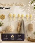 Super Slick Punch Free Wall Hook Rack With 180 Degree Swivel Design And Six Sturdy Hooks For Dead Simple Corner Storage That Rotates Smooth As Butter Without Drilling, in use with towels and utensils.