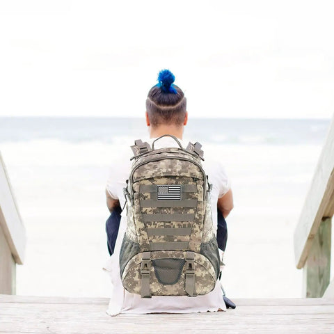 Person wearing Beefy 30L Tactical Backpack For Men With Molle System Waterproof Day Pack For Hiking And Outdoor EDC ACU Style Military Rucksack.