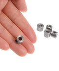 uxcell stainless steel set-screw shaft collar; 4 mm bore, 9 mm OD, held between fingers