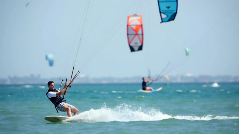 Person enjoying kite surfing on ocean, showcasing the excitement of saltwater adventures using floating nylon marine rope with hook.