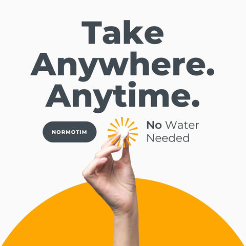 Hand holding a tablet against a background that reads 'Take Anywhere. Anytime. No Water Needed. NORMOTIM'