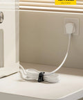 Silicone Cable Ties 10 Pack Cord Organizer with Secure Lock Buckle in use, managing cables on a tabletop, near an outlet.
