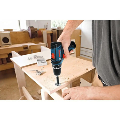 Person using Ultra Lightweight 12V Max Drill/Driver Bare Tool With 3/8 Inch Chuck, 265 In Lbs Torque, 1300 RPM on wood