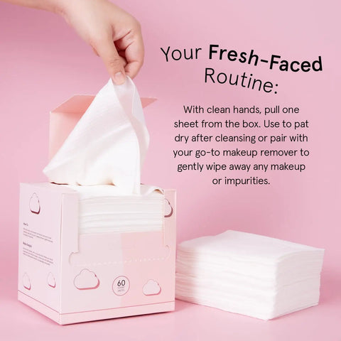 Hand pulling Ultra Soft Disposable Face Towels For Travel Essentials On The Go Extra Large Wipes For Cleanse And Makeup Removal