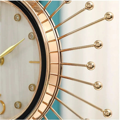 Close-up of Modern Marble Desktop Clock With 18K Gold Plated Frame showcasing the elegant gold spikes and clear dial.