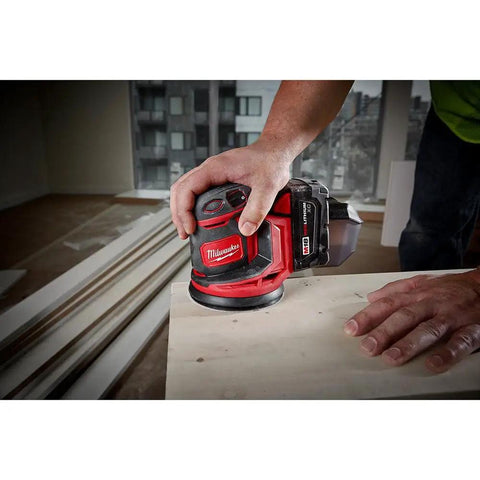 Kickass Five Inch Random Orbit Sander Bare Tool With Quick Variable Speed Dial And Smooth Finishing Muscle Plus Premium Heavy Duty Rolling Cart For Pro Shop Storage And Woodworking Builds, used on wood surface by hand.