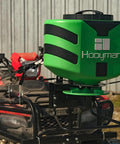 ATV Seeder With 125 Lb Hopper And Universal Mounting System For Easy Fit shown on an ATV, ideal for land management.