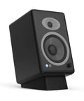 Angled Desktop Speaker Stands With Anti Slip Silicone Wedges For Medium Speakers, Vibration Resistant Riser in use with speaker.