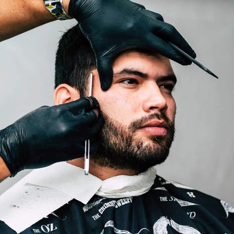 Heavy Duty Black Nitrile Disposable Gloves 4 Mil Thick X Large 100 Count Food Safe used by barber during grooming.