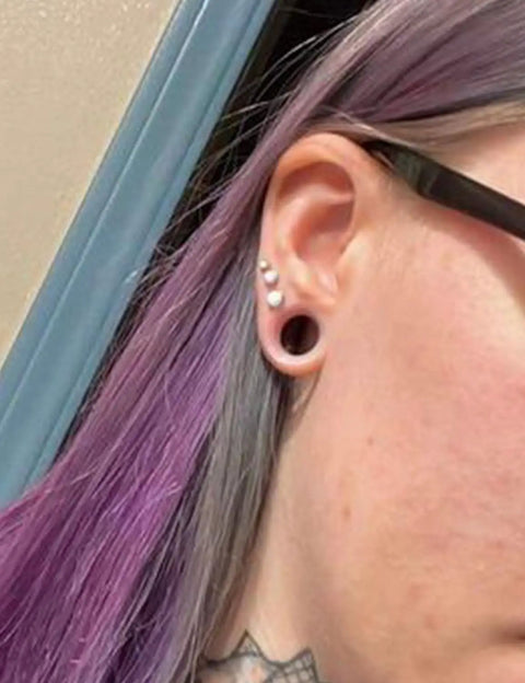 Side view of ear with 10G Clear Silicone Ear Gauges Tunnels Plugs Retainer Set Four Pairs Ultra Thin Soft Flexible Double Flared Saddle Jewelry