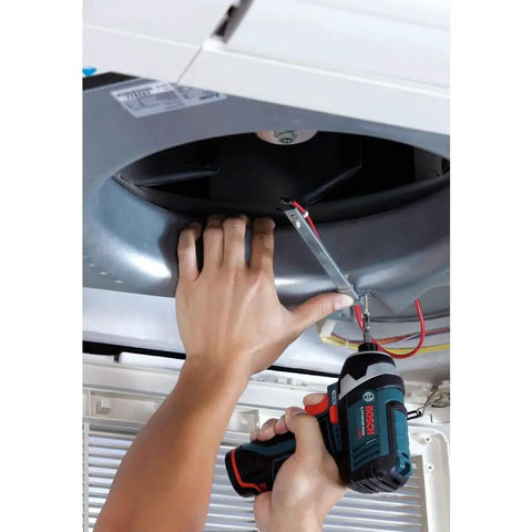 Person using 12V Max Impact Driver Kit With 930 In Lbs Torque Ultra Compact Five Point Four Inch Head For Tight Spaces Lightweight