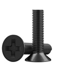 Close-up of black screws from All Purpose Pro Grade 500 Piece Screw Kit With M1.2 M1.4 M2.0 Small Screws For Laptop PC Motherboard SSD And Glasses.