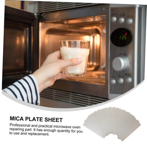 Person placing a glass in a microwave, stack of Six Pack Microwave Mica Sheets Waveguide Cover Heat Resistant Insulation Pads shown.